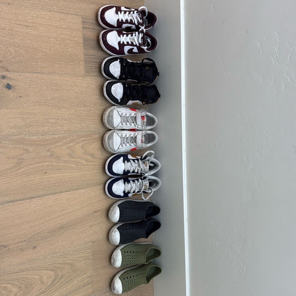 Various Nike and Native shoes.